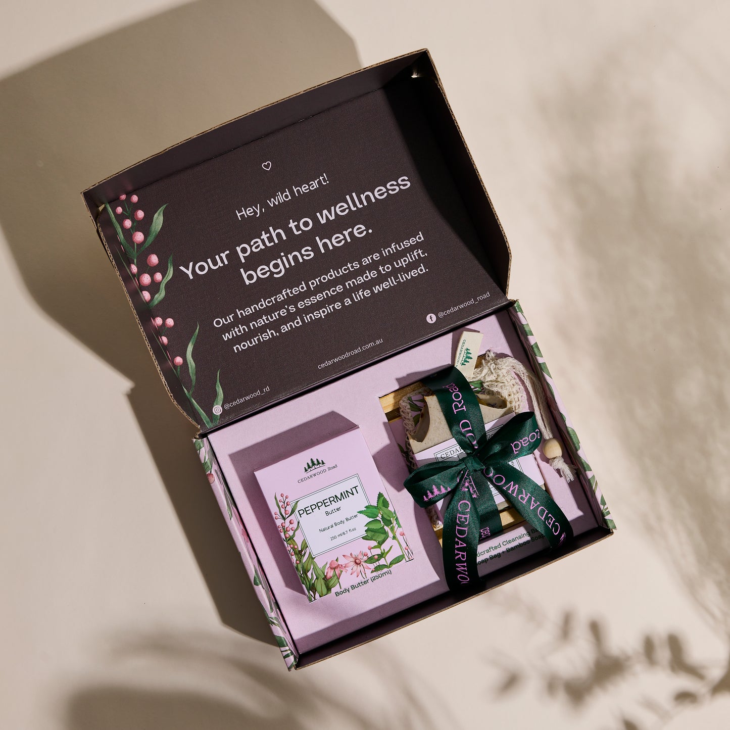 Open box containing wellness products with a message about nature's essence.